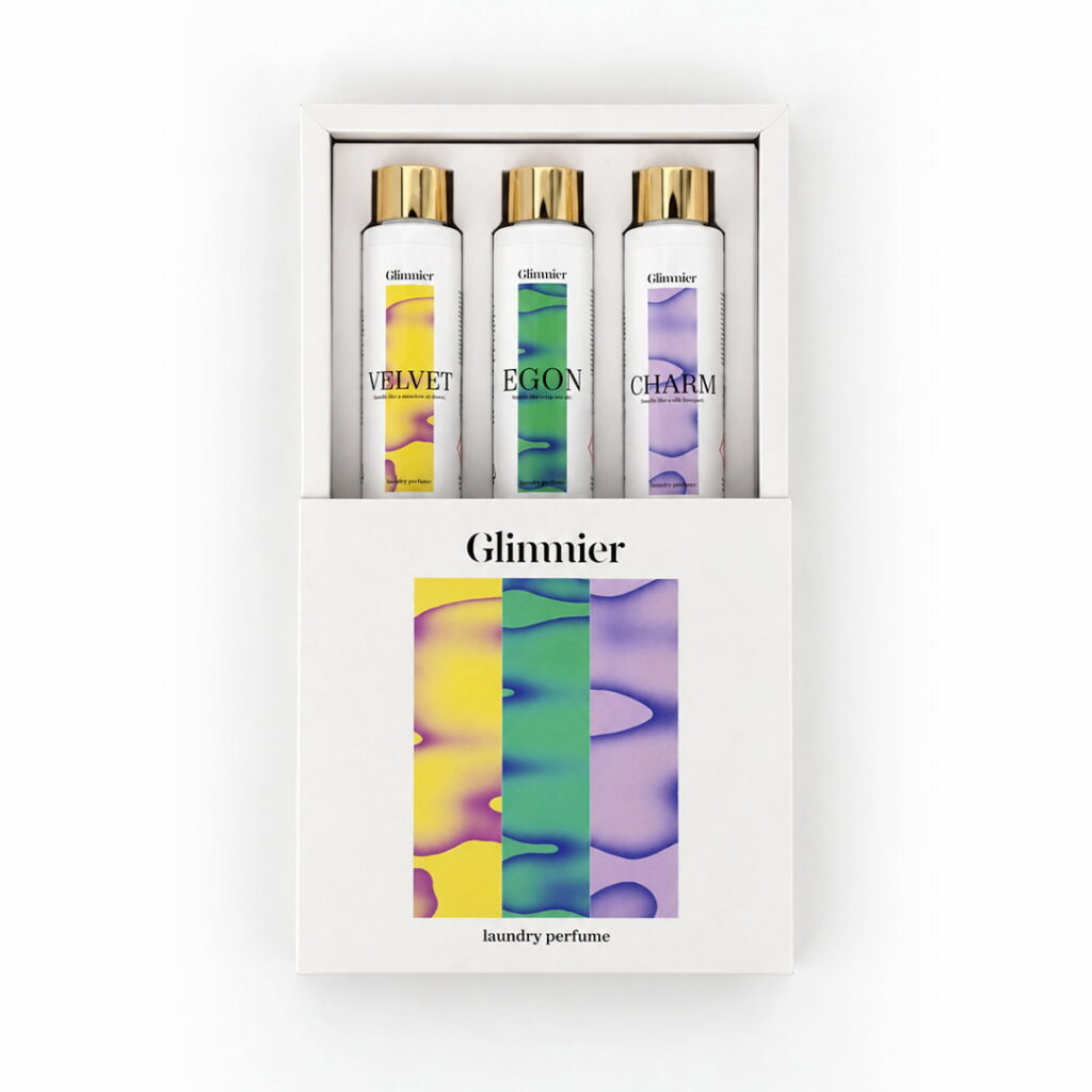 Geopende Glimmier geschenkset doos met drie wasparfum flessen