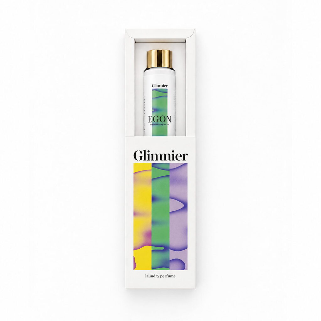 Glimmier EGON wasparfum fles naast de witte verpakking